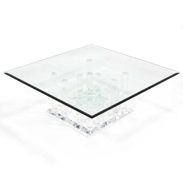 We have nicknamed this elaborate coffee table the "cityscape" table as the base features 18 rectangular forms of varying...