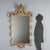 Carved and gilded wood mirror dating from the early 20th century, originating from Italy. The molded and openwork frame is...