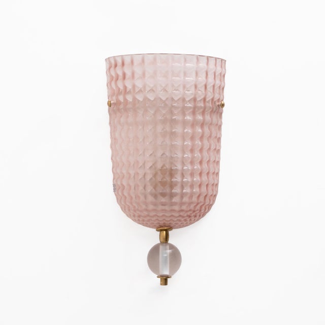 Elegant pink murano glass wall sconces, featuring a refined art deco-inspired design. the diffuser has a soft, gently...