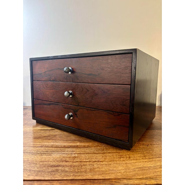 A rare and highly collectible jewelry cabinet by Harvey Probber, exemplifying the designer’s early mastery of refined...