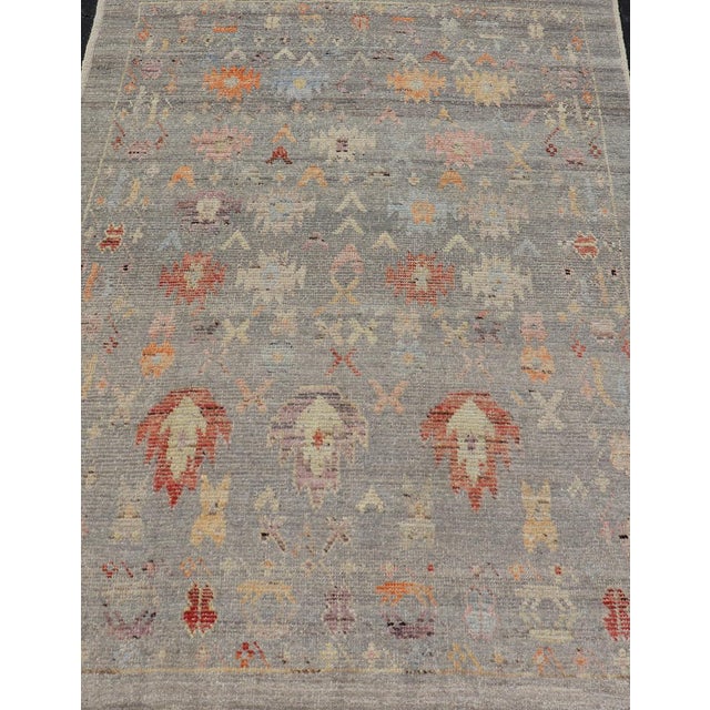 This charismatic piece holds much personality in the all-over design of motifs. The tribal-like motifs are rendered in...