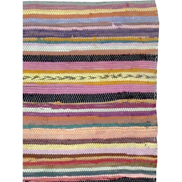 A vintage American Rag throw rug handmade during the Mid-20 century. Measures: 2' 1" x 4' 5"