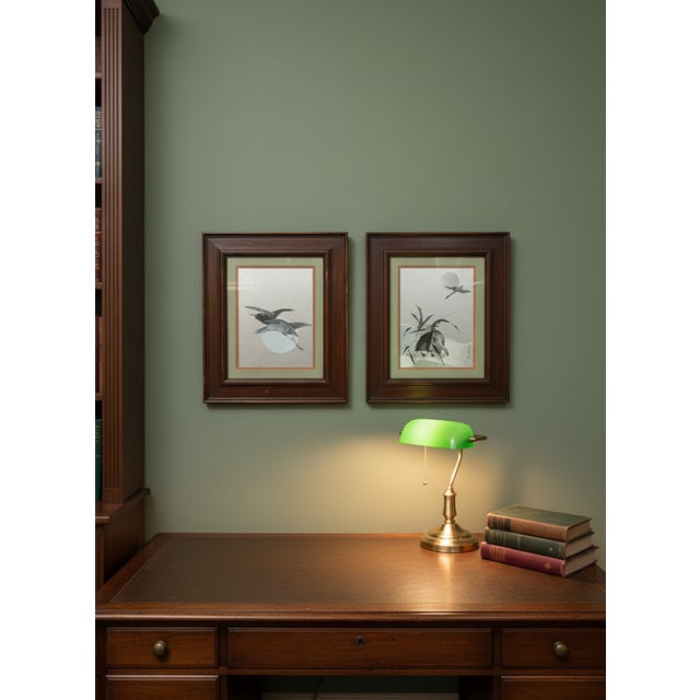 This pair of framed artworks are Japanese woodblock prints, part of the Shin-hanga ("new prints") movement. The pieces...