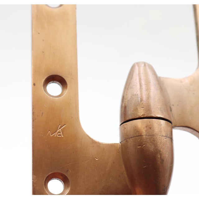 This vintage brass McKinney olive door hinge swings open to the left. The original mounting screws are not available. Good...