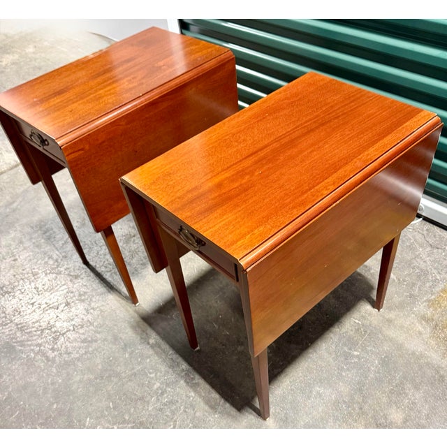 This pair of unique tables exude a traditional aesthetic, of Federal or Hepplewhite style furniture, making them versatile...