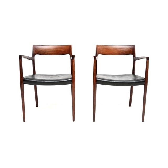 An exceptional pair of Danish vintage model 57 chairs by Niels Moller. They were made in Denmark by JL Moller Mobelfabrik,...