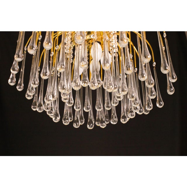 Gorgeous and unique pair of Murano chandeliers in the style of Venini La Cascata. The structures are in good aesthetic...