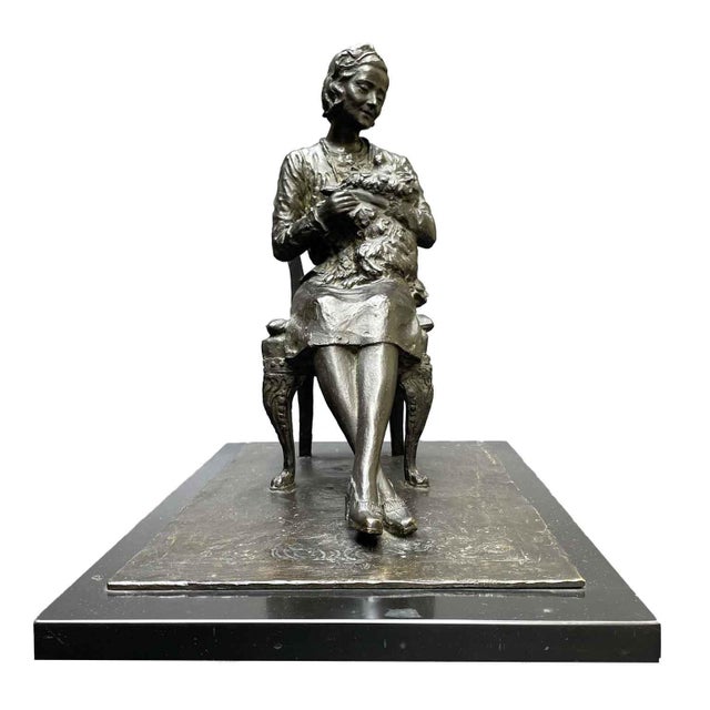 Leonardo Secchi, Lady Seated with Dog, 1942, a dark-patina earth cast depicting a woman sitting on a chair atop an...
