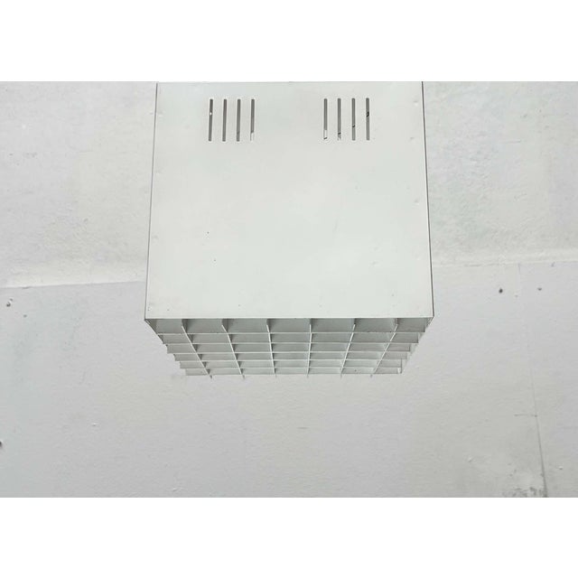 Minimalist ceiling light from Finland. The design features a simple cube shape and is finished in white. The underside is...