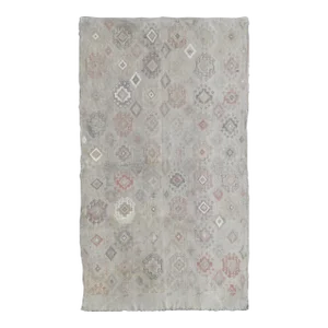 Mid 20th Century Vintage Turkish Kilim Featuring Muted Colors and All-Over Tribal Motif Design