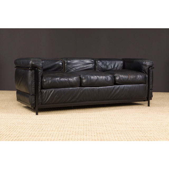 This incredibly comfortable Le Corbusier for Cassina 'LC2' three-seat sofa (authentic signed and earlier year production...