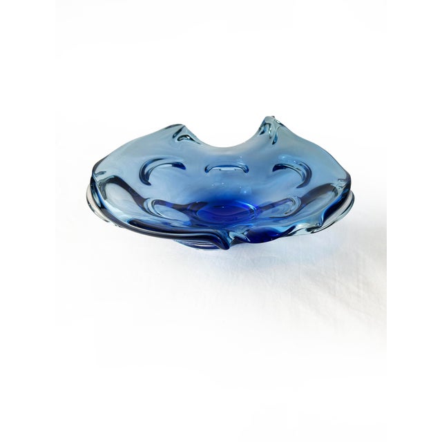 A striking example of mid-century Bohemian glass, this sculptural hand-blown bowl was designed and produced by Chřibská...