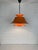 Radius pendant light in orange, a classic of Scandinavian lighting. Design by Eric Balslev in 1977 for Fog&Morup, Denmark....