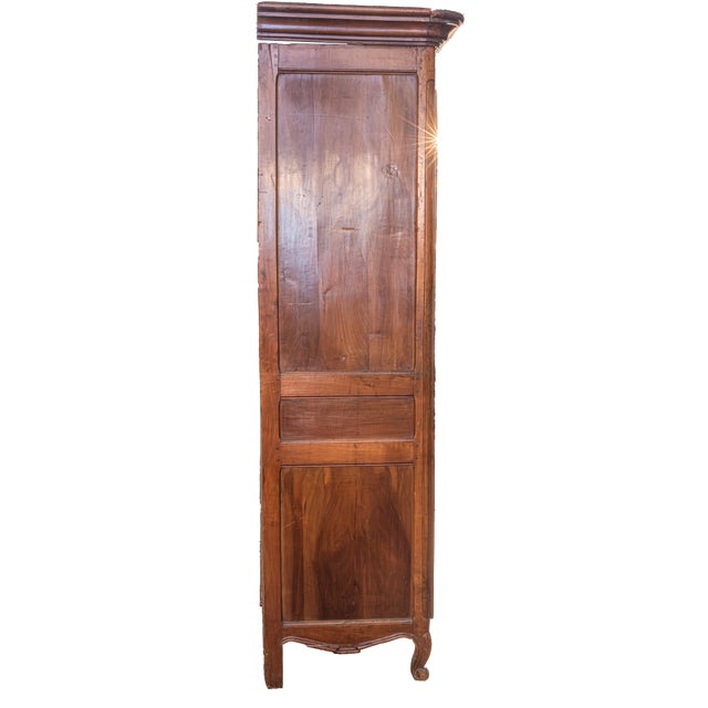 A beautiful and authentic piece of 18th-century French Provincial furniture, this tall, single-door armoire, also known as...