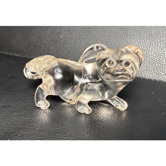 Up for sale is a lovely antique hand carved Chinese foo dog clear rock crystal sculpture. This intricate and detailed...