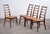 Elegant set of 4 'Lis' dining chairs designed by Niels Koefoed in beautifully grained rosewood. A slim, refined, and...