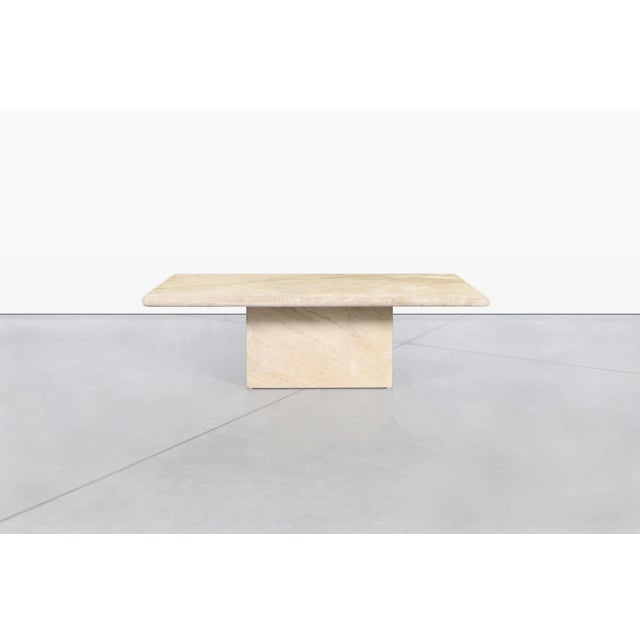 This vintage Italian travertine coffee table embodies the sculptural simplicity and refined craftsmanship that made...