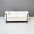 Lc2 two-seater sofa, with black tubular structure with satin finish and completely removable cover in white cotton fabric....