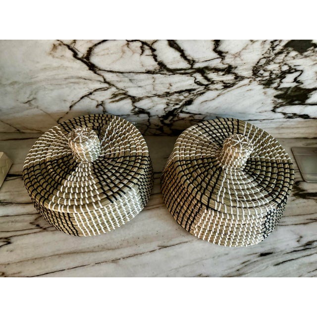Pair of beautiful handcrafted rustic style, organic natural grass/raffia, white and black detailing round decorative...
