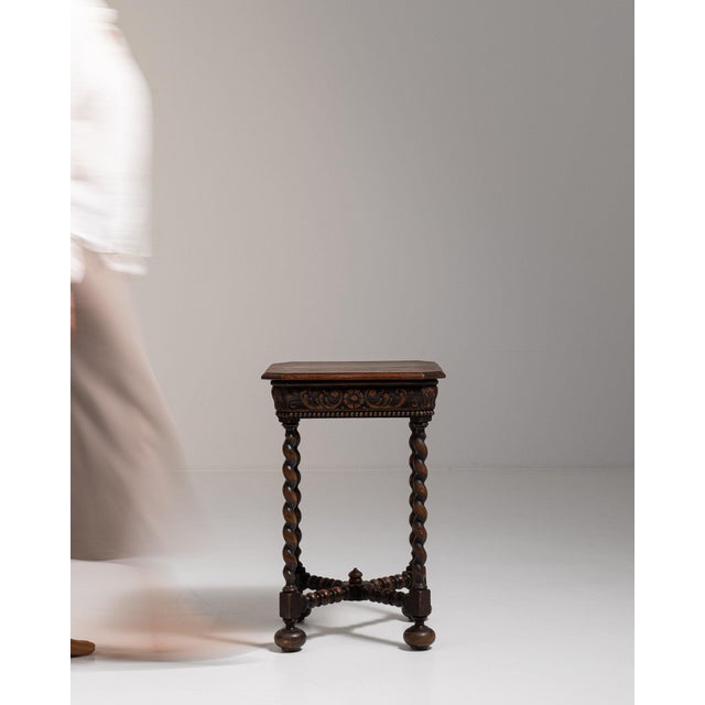 Carved barley-twist pedestal side table in Deep Walnut Brown. Finished in deep walnut brown, this carved barley-twist...