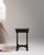 Carved barley-twist pedestal side table in Deep Walnut Brown. Finished in deep walnut brown, this carved barley-twist...
