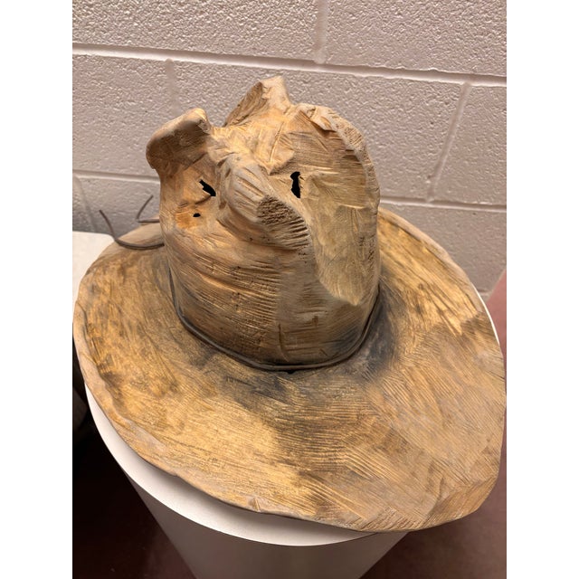 This carved wood cowboy hat came out of a prominent estate in East Cleveland. The artist name, shown in picture, is...