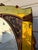 Vintage Art Deco Waterfall Dresser With an Attached Arched Mirror Featuring Amber-Tinted Glass Panels and Geometric Wood Inlay on Casters For Sale - Image 9 of 12