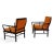 A pair of painted mid century modern armchairs with Chinoiserie influence. Upholstered and tufted seats and back.