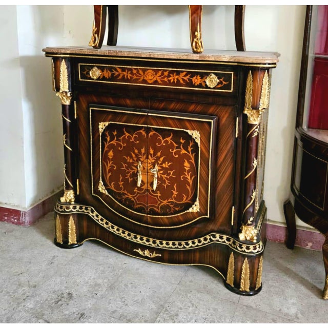 Bring timeless European elegance into your home with this exquisite luxury buffet cabinet. Featuring a richly figured wood...