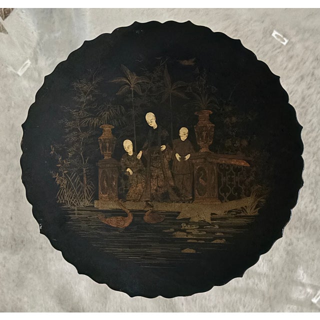 A beautifully decorated Victorian English papier maché pedestal dish finished in black jappaned lacquer with finely gilded...