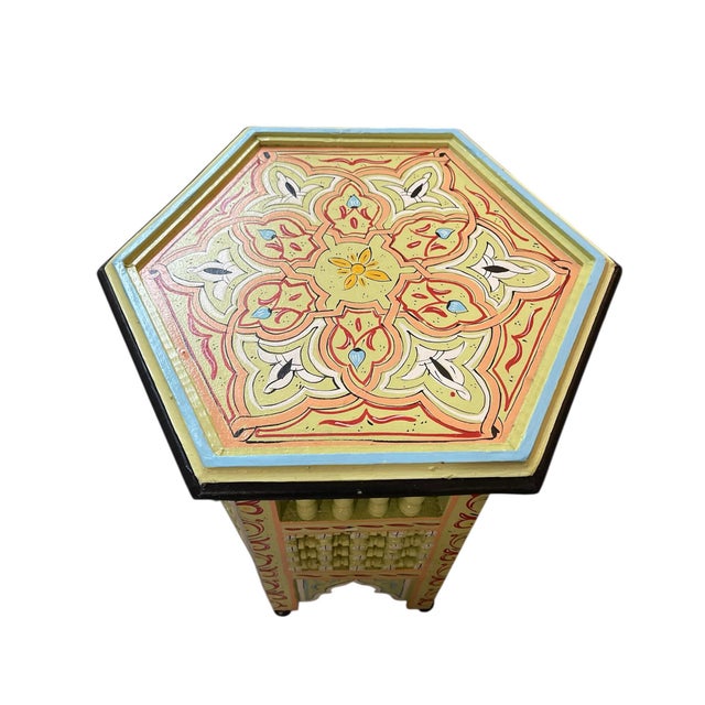 Featuring a classic hexagonal silhouette, this piece is a celebration of traditional Zouaq (wood painting) techniques,...