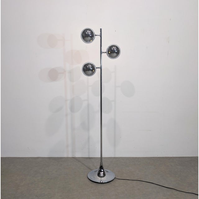 1970s space-age floor lamp Chrome-plated metal floor lamp with three arms. Three rotating ‘eyeball’ globes typical of the...