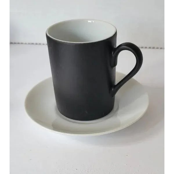 1960's set of 8 matt black and gloss white demitasse or tea cups with white gloss porcelain saucers made by Kenji Fujita...