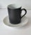 1960's set of 8 matt black and gloss white demitasse or tea cups with white gloss porcelain saucers made by Kenji Fujita...