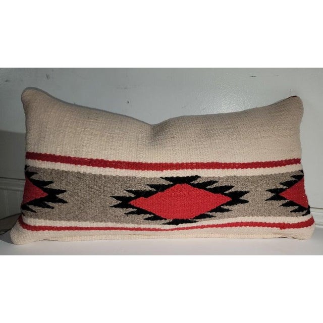 hand weaving eye dazzler bolster pillows with red linen backings. The inserts are down & feather fill. Sold as a pair.