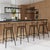 Embrace the timeless appeal of the Merrick Wood and Iron Spindle Bar Stool that features a comfortably contoured seat and...
