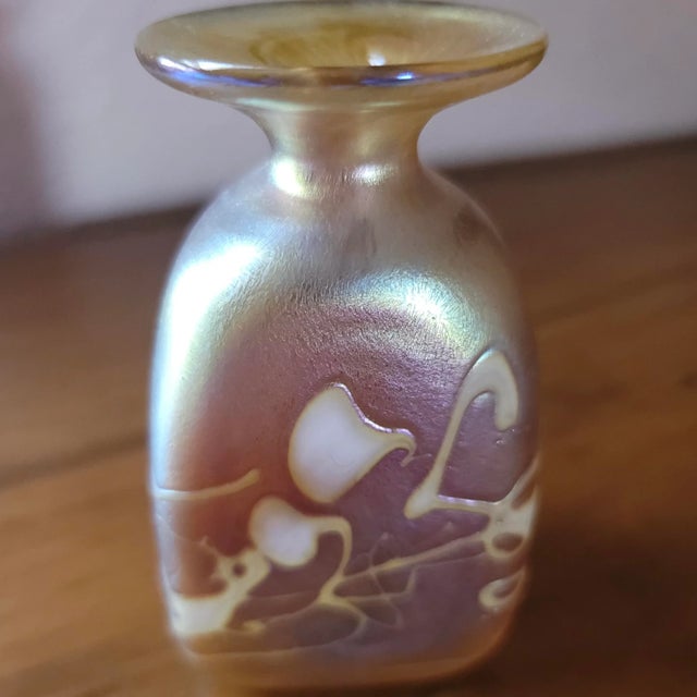 Artist signature:”RHAG” Robert Held Art Glass Vintage Hand Blown Glass mini vase. Soft gold iridescent vase with ivory...