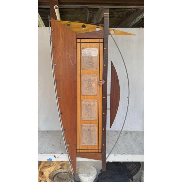 A truly extraordinary and highly unusual Post Modern hanging wall cabinet that blurs the line between functional furniture...