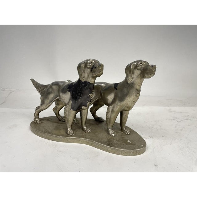Pewter statuette depicting a pair of dogs. Excellent decorative object.