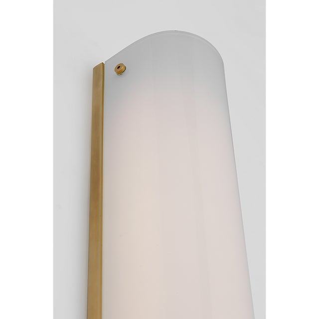 Penhold 18" Bath Light in Soft Brass with White Glass Designer: Barbara Barry Finish: Soft Brass Height: 18" Width: 3.25"...