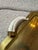 A distinctive Italian Mid-Century Modern serving tray crafted in polished brass, featuring elegant faux tusk handles with...