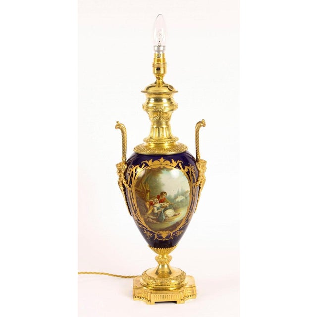 This is a stunning large antique French Sevres cobalt blue hand painted porcelain and ormolu-mounted vase circa 1880 in...