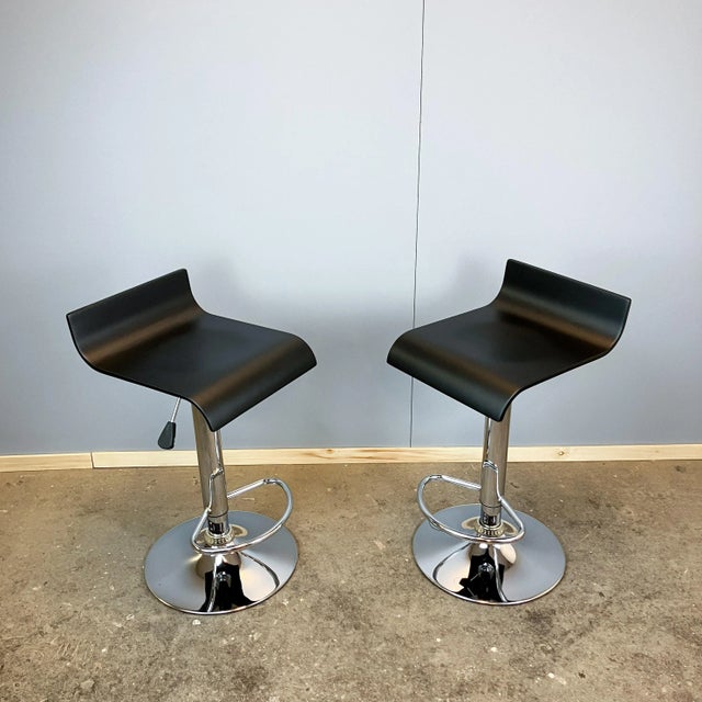 Two elegant bar stools in the typical 70s style – simple, modern, and functional. Their clean lines and the interplay of...