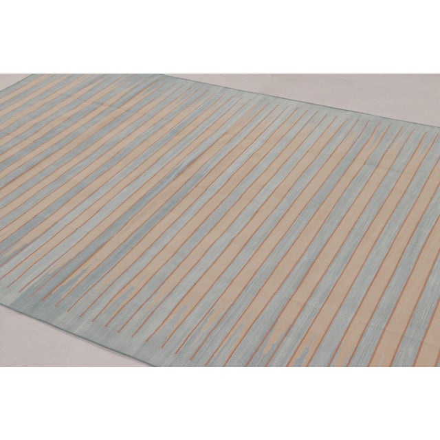 This 6x9 Dhurrie rug represents an exciting contemporary flatweave collection from Rug & Kilim—a modern take on antique...