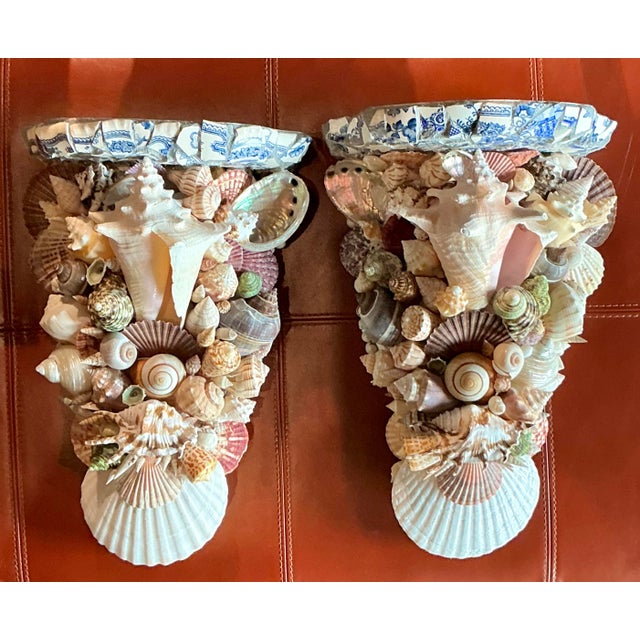 Embrace a spirit of coastal maximalism with this extraordinary pair of vintage shell-encrusted wall brackets. Meticulously...