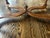 This oak coffee table features the distinctive Ethan Allen design with an elegant oval top, beautifully curved/serpentine...