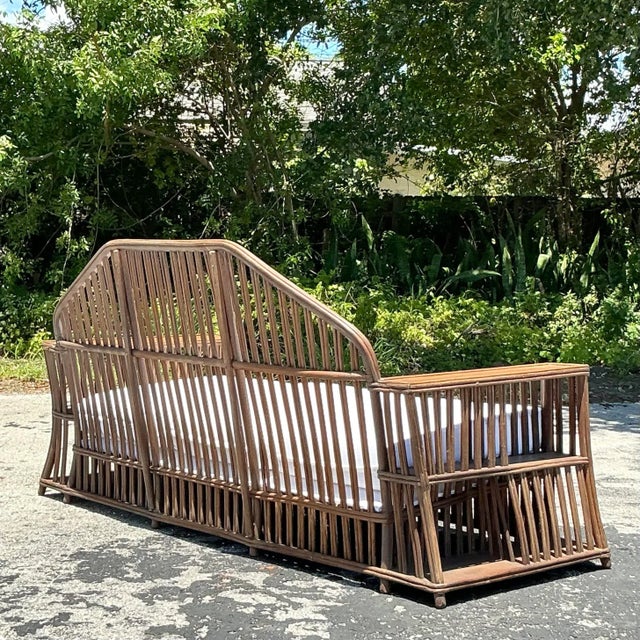 "Introducing our American-style Vintage Coastal Faceted Stick Rattan Sofa, inspired by the iconic designs of Heywood...