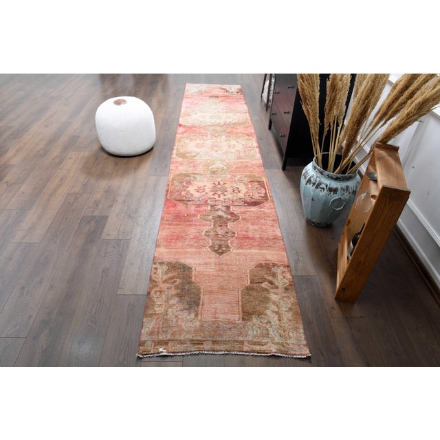 Vintage Persian Hand-Knotted Runner rug is a semi-antique vintage runner rug. The '70s Eastern region of Anatolian's...