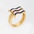 Stylish vintage nautical flag ring crafted in 18 karat yellow gold (circa 1970s). Rendered in vibrant red, white, and blue...
