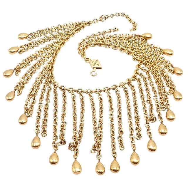 Vintage Van Cleef & Arpels 18k yellow gold fringe bracelet featuring cascading chain tassels and polished teardrop charms....